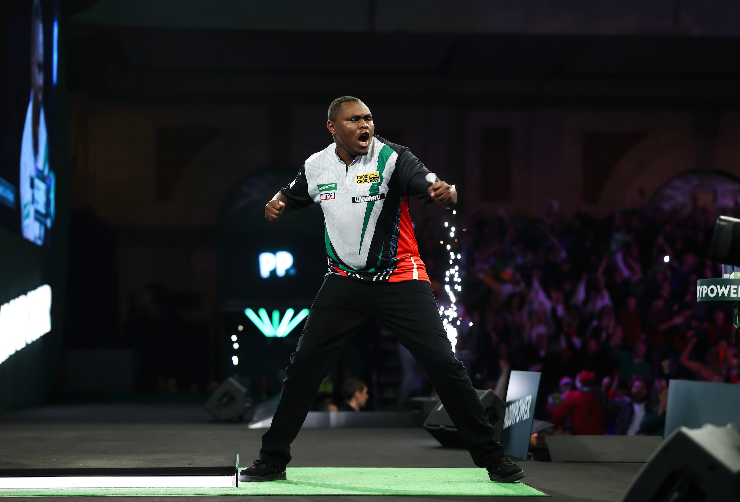 kenyas-munyua-makes-history-as-he-shocks-world-number-18-de-decker-at-darts-worlds